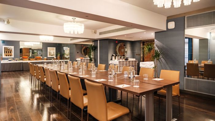 Meeting room with long table and chairs