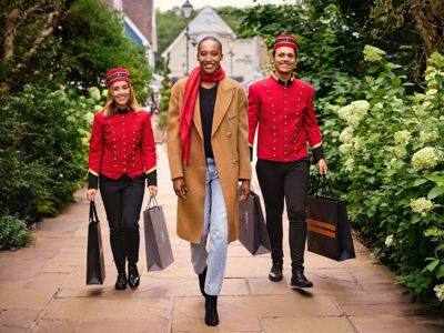 person with two hands-free shoppers at Bicester Village