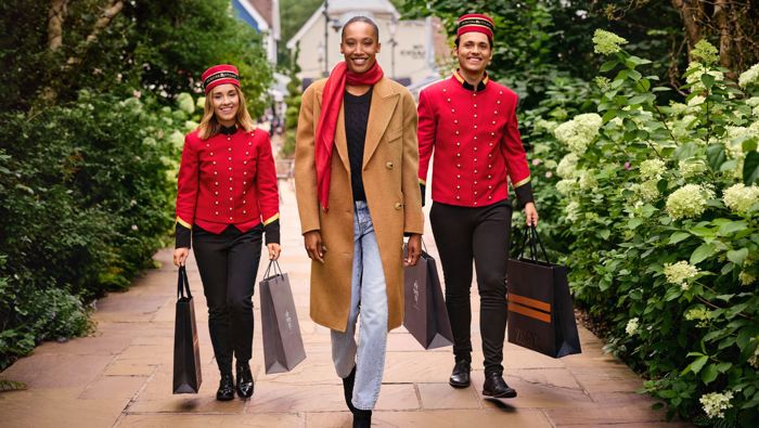 person with two hands-free shoppers at Bicester Village