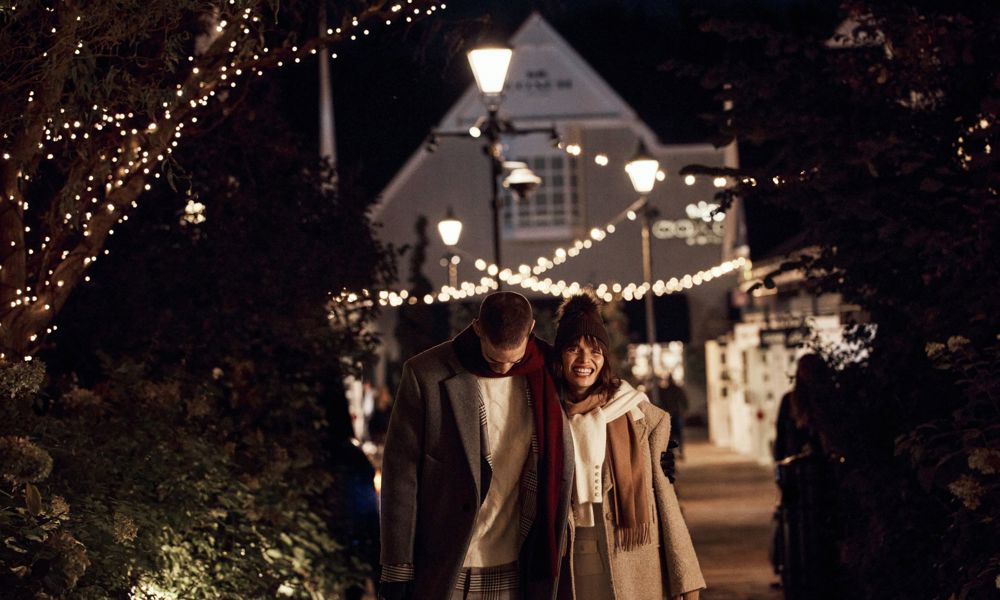 Couple at night in Bicester Village winter