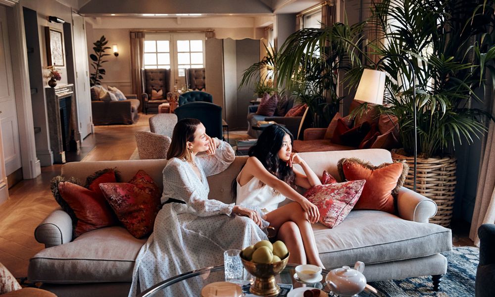 Women relaxing on a sofa at Bicester Village