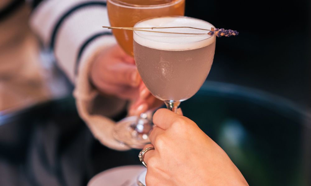 two cocktails clinking