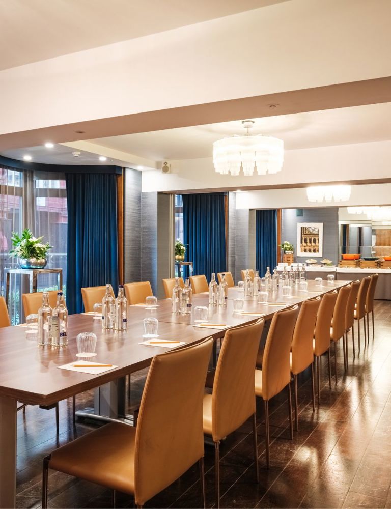 Meeting room with long table and chairs