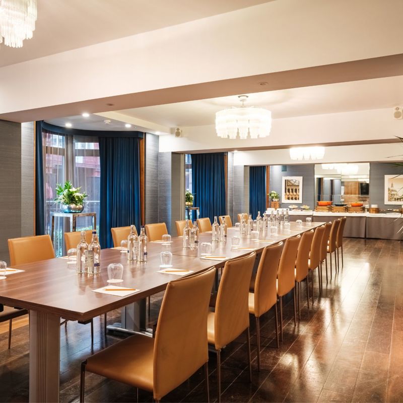 Meeting room with long table and chairs