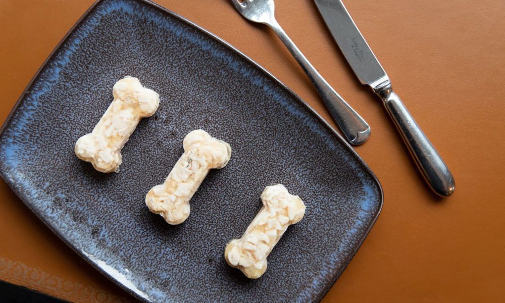 Dog treats on a plate with knife and fork