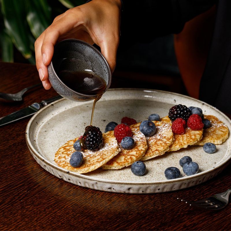 pouring vinegar over salad