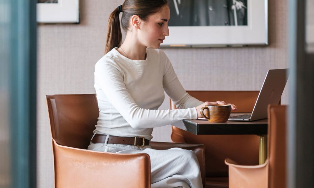 Women sitting in chair at laptop