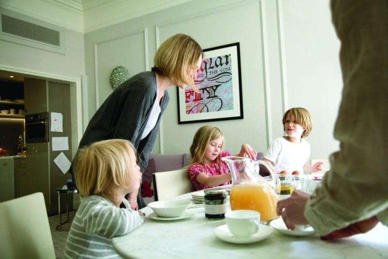 A family enjoying breakfast at The Athenaeum's luxury serviced apartments in London