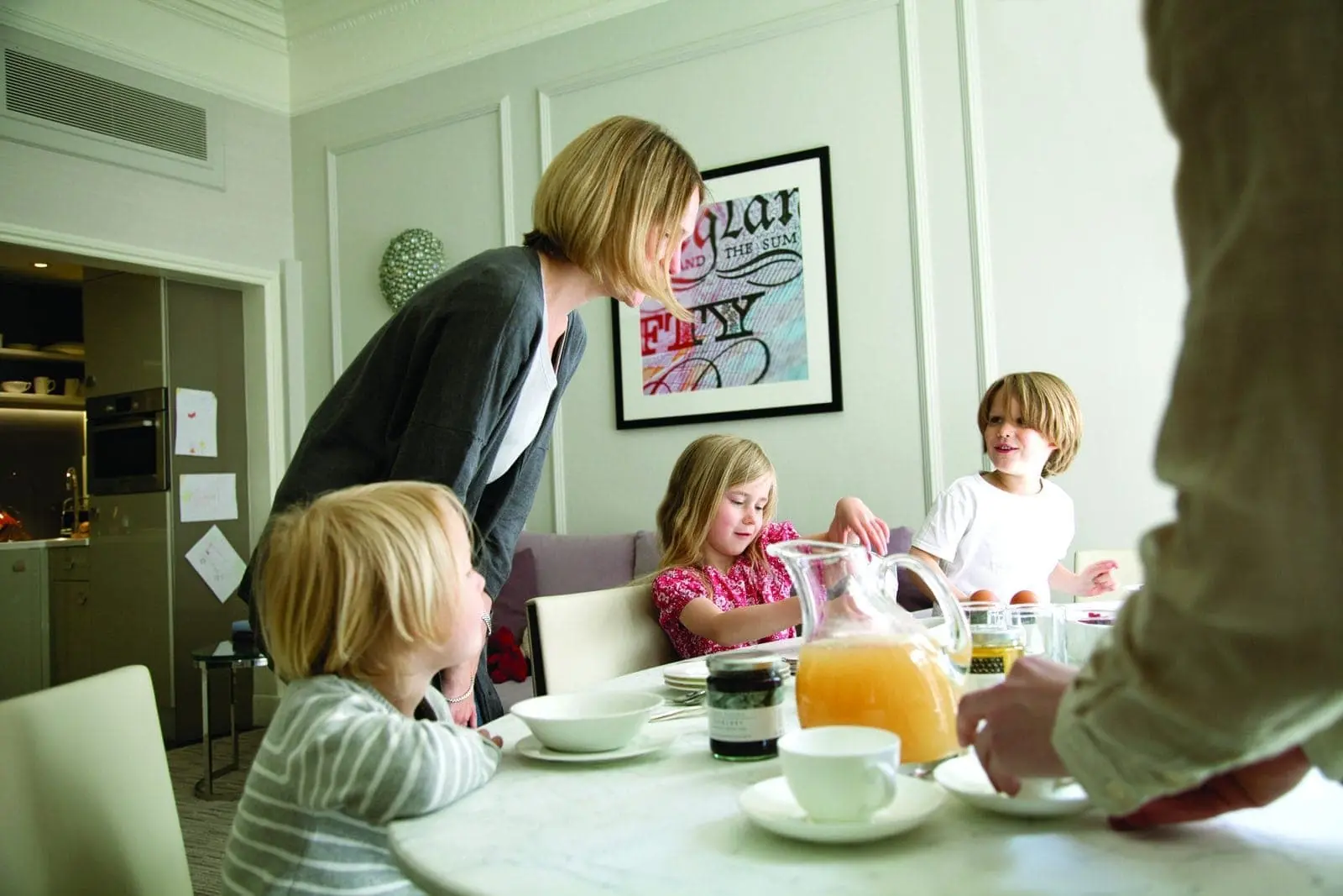 A family enjoying breakfast at The Athenaeum's luxury serviced apartments in London