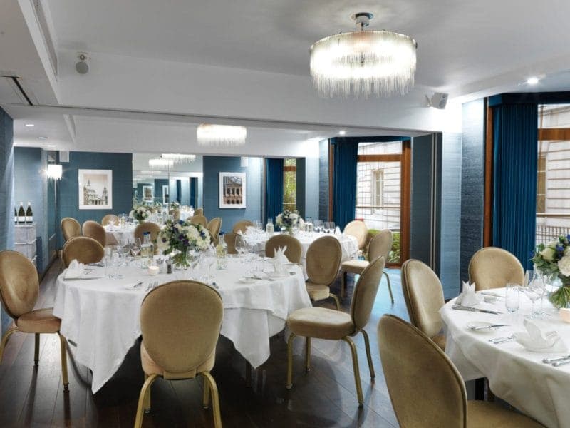 Hyde Park set for dinner round tables