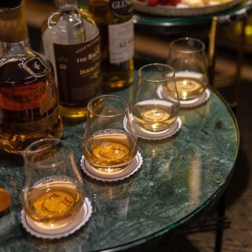 A collection of various whiskies at a whisky tasting in London at The Athenaeum Hotel