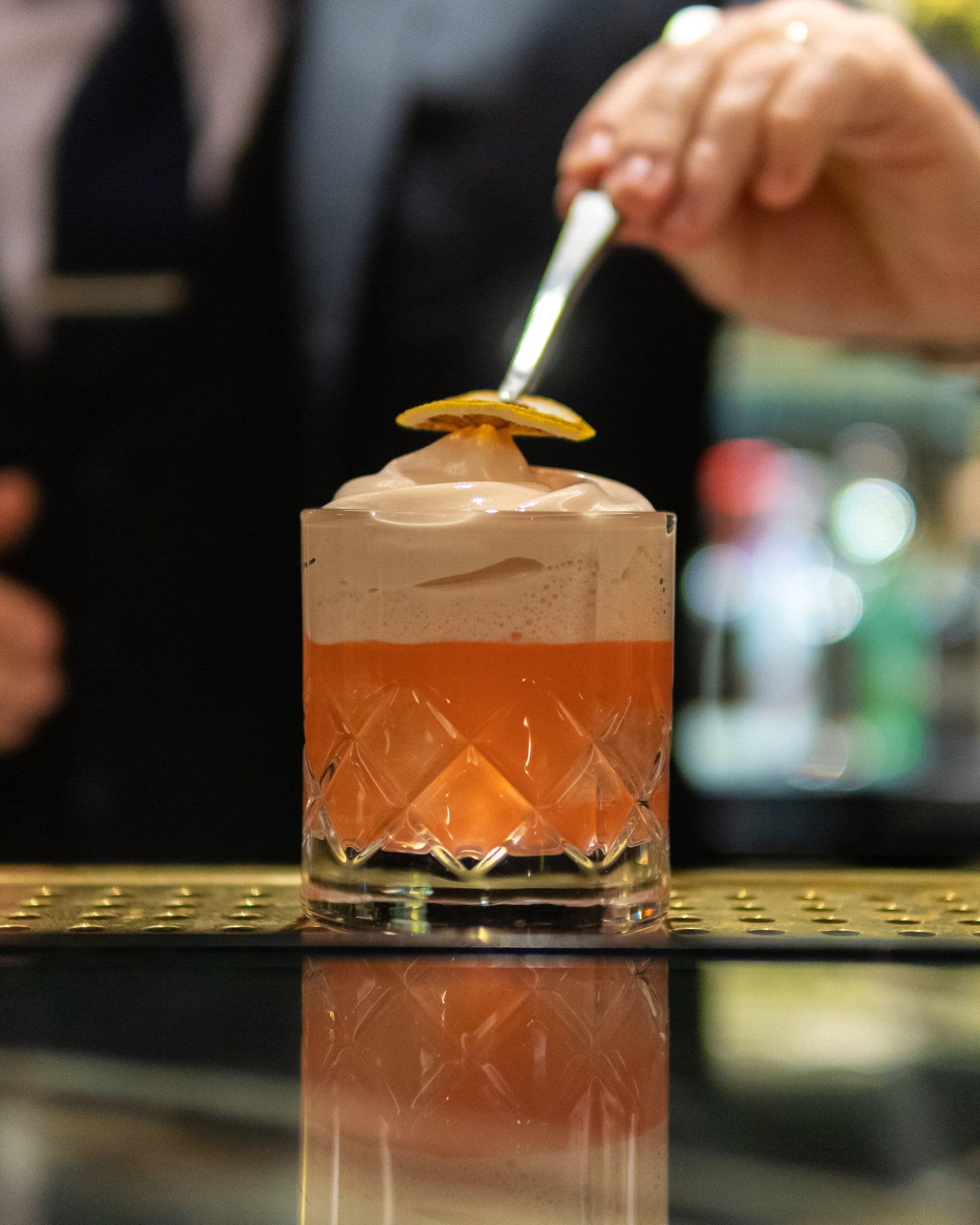 A cocktail being poured at The Athenaeum's cocktail bar in Central London