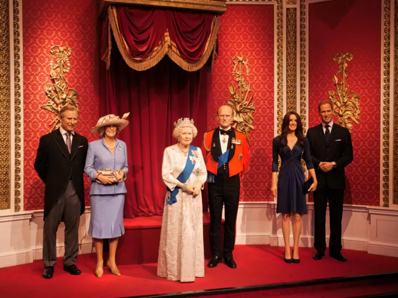 Wax figures of The King with his family: the late Queen and the late Duke of Edinburgh at Madame Tussauds in London
