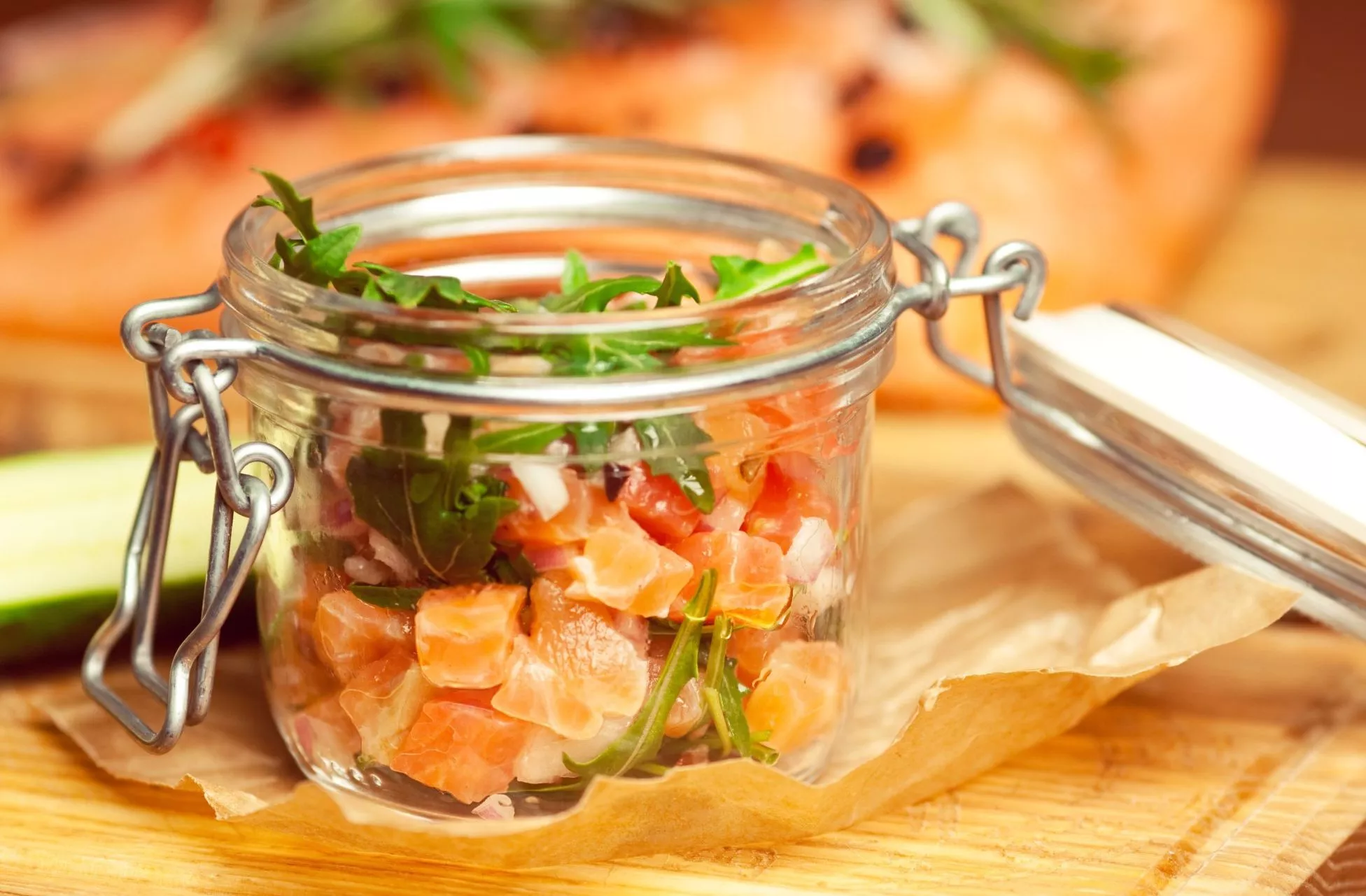 Mason,Jar,With,Pieces,Of,Salmon,With,Fresh,Cucumber,And