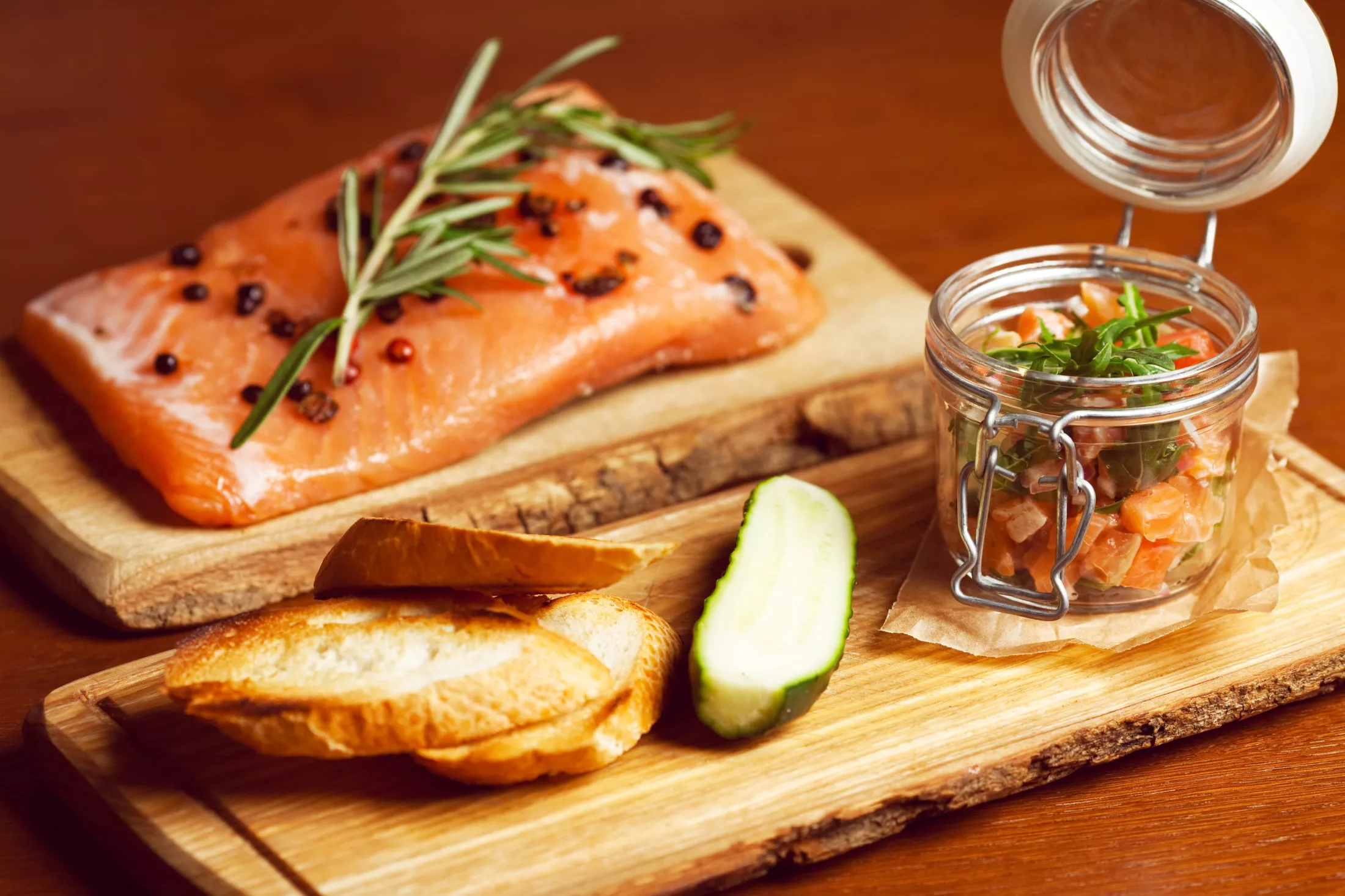 Mason,Jar,With,Pieces,Of,Salmon,With,Fresh,Cucumber,,Toasts