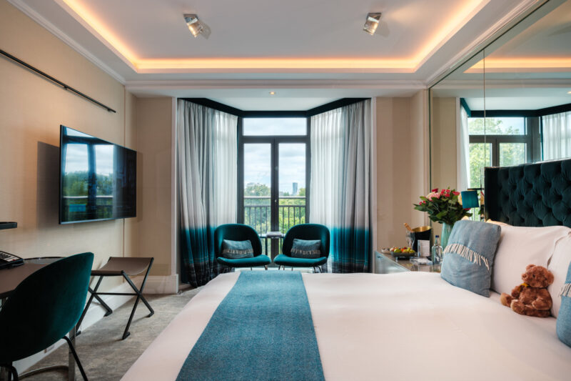 The combined bedroom and living room space of The Athenaeum's family suite in London.