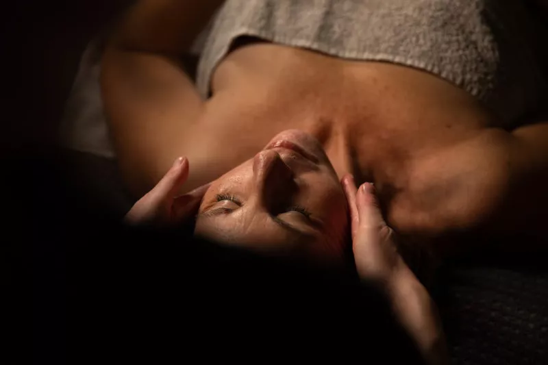 a woman enjoying a massage from her overnight spa break for couples