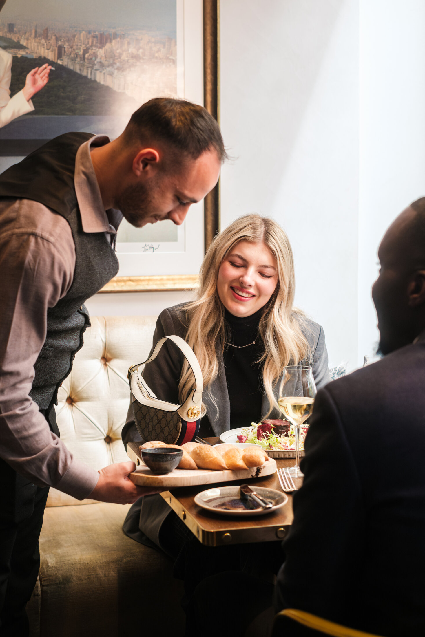 Eat. Waiter serving food in 116 at The Athenaeum Mayfair Restaurtant