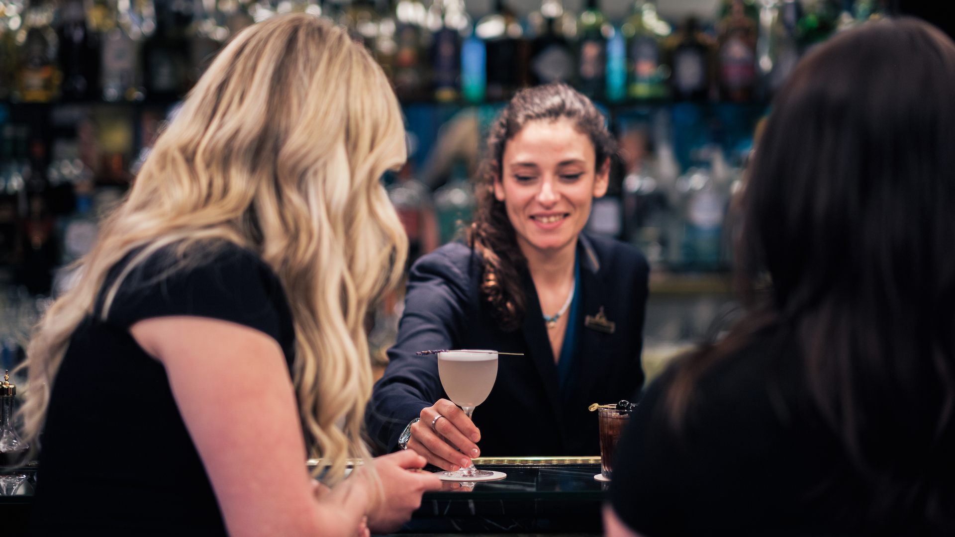 Mayfair Bar serving guests cocktails at The Athenaeum Hotel